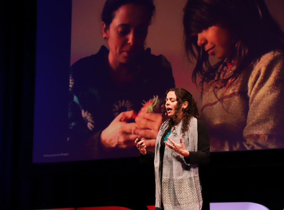 Image of Yael Warshel delivering TEDx talk