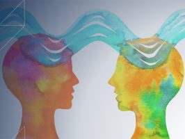 Two colorful head silhouettes facing each other